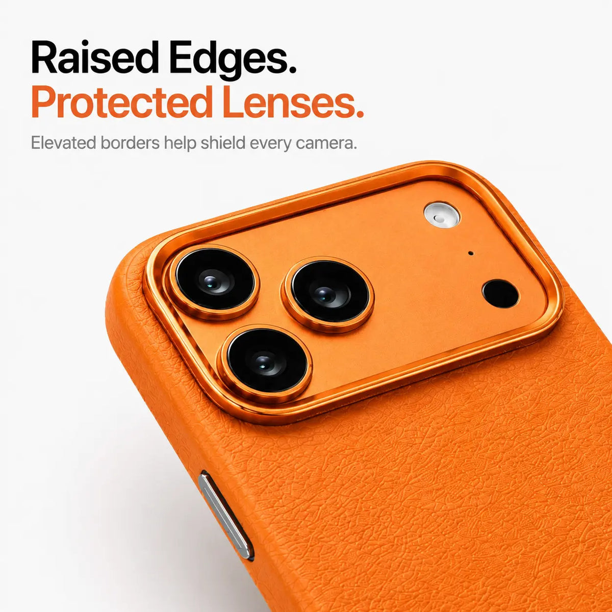 Orange textured leather phone case in close-up showing the raised camera surround and lens edges #color_Cosmic Orange