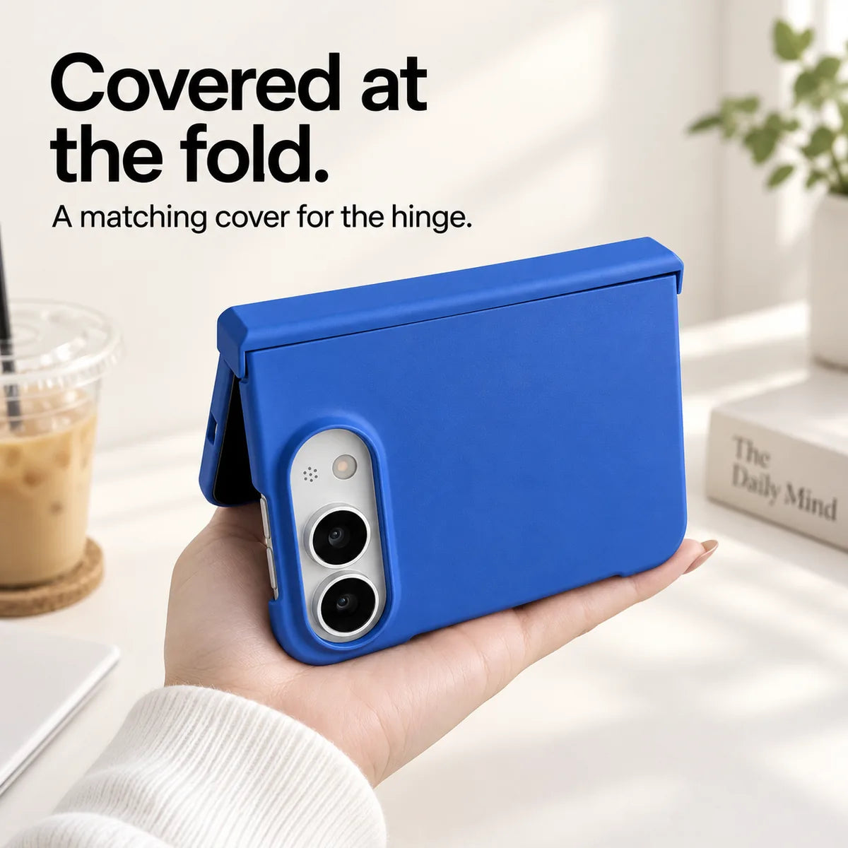 Blue iPhone Ultra case held partly folded, showing the matching cover along the hinge. #color_Cobalt Blue