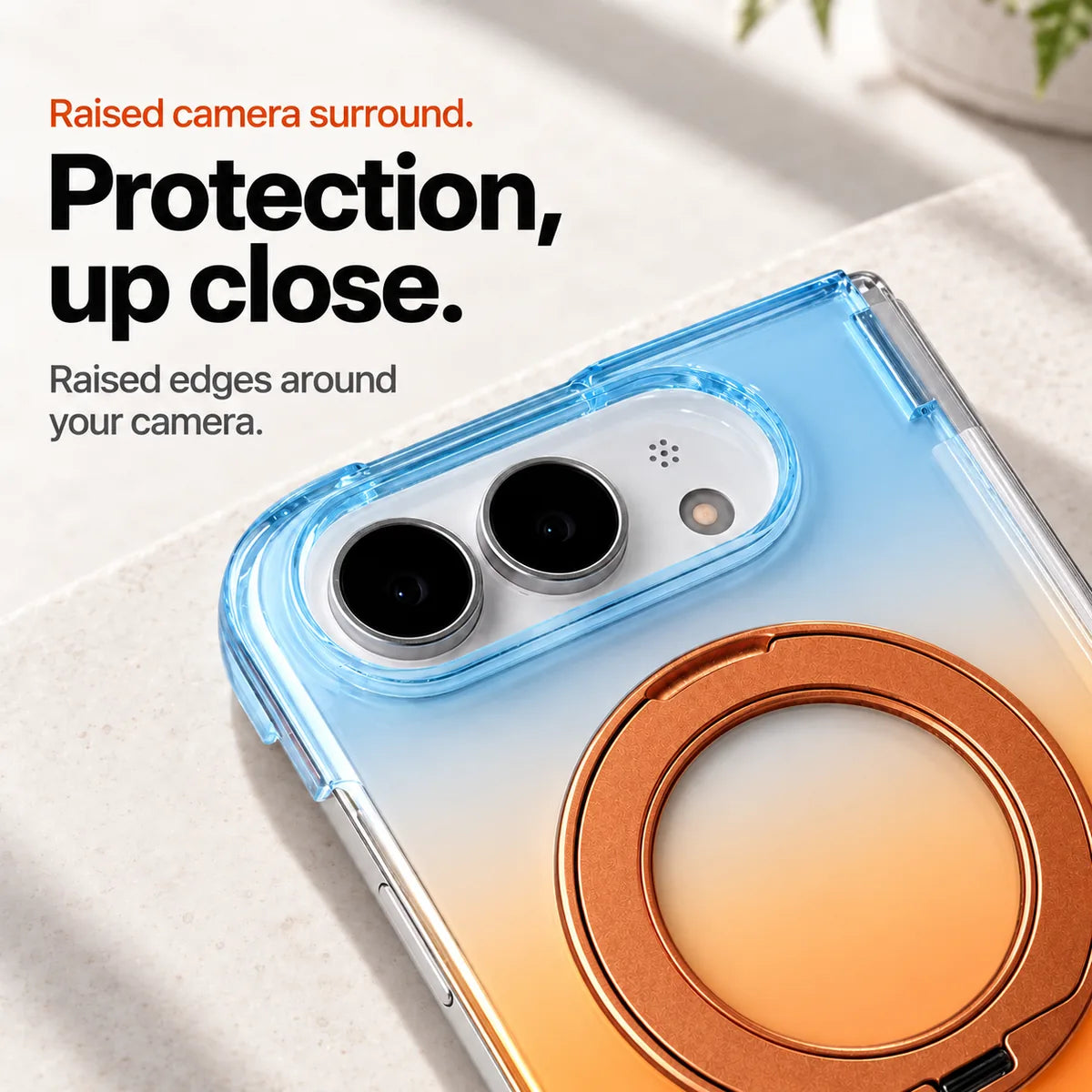 Blue and orange gradient phone case close-up showing the raised oval camera surround and folded ring. #color_Solar Haze