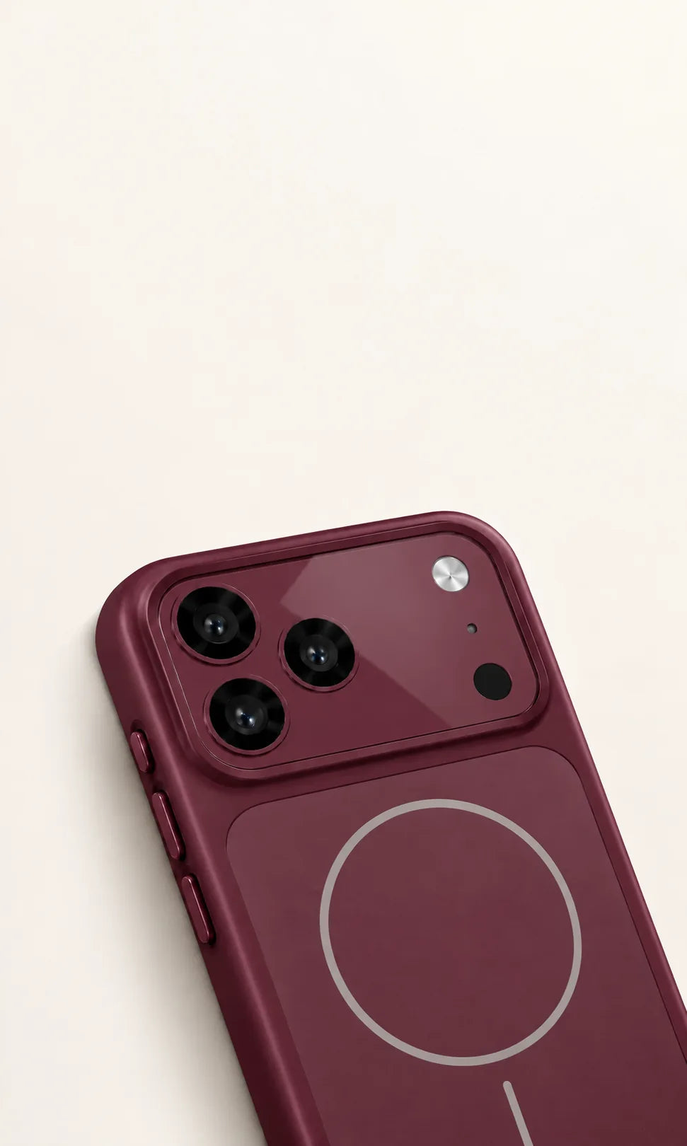Raised Burgundy camera cover around three rear camera lenses.