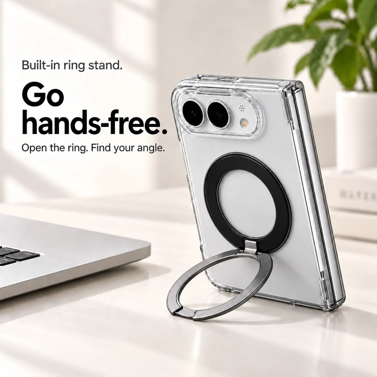 Clear case supporting a folded silver phone on a desk with its ring stand open. #color_Pure Crystal