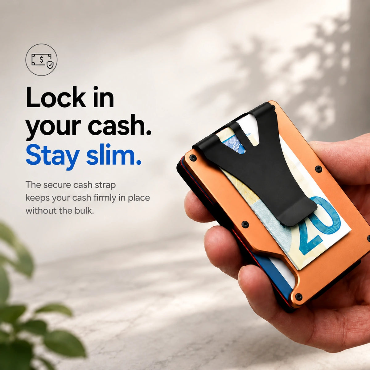 Cosmic Orange slim tracking card wallet holding cash under the clip #color_Cosmic Orange