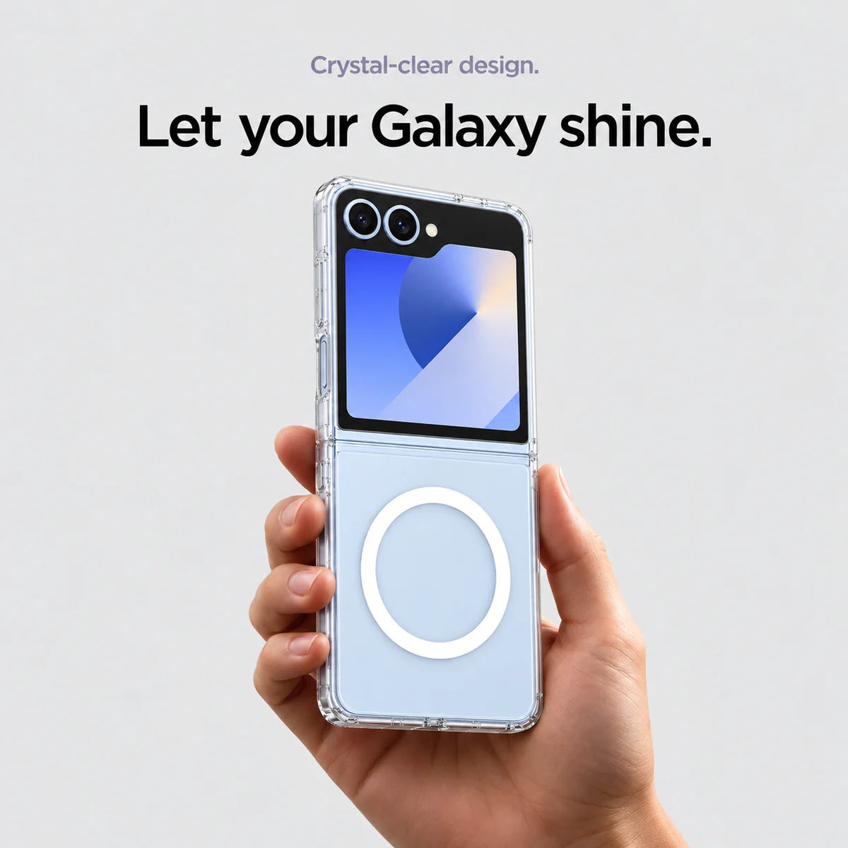 Clear magnetic phone case held at an angle, showing its transparent back and camera openings. #Samsung Model_Samsung Z Flip 6