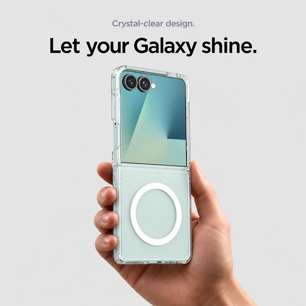 Clear magnetic phone case held at an angle, showing its transparent back and camera openings. #Samsung Model_Samsung Z Flip 7
