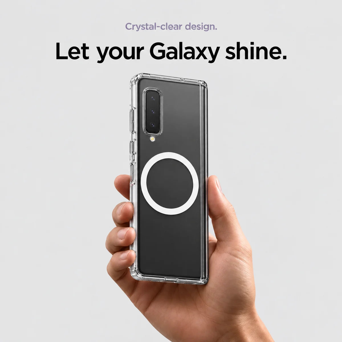 Clear magnetic phone case held at an angle, showing its transparent back and camera openings. #Samsung Model_Samsung Z Fold
