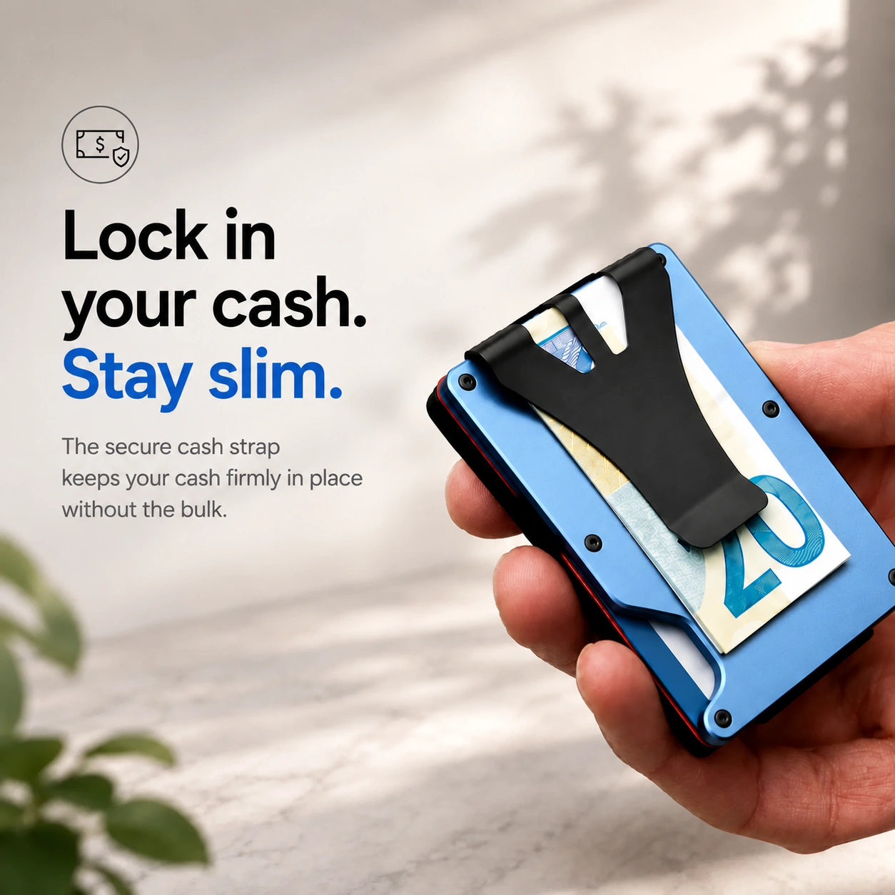 Glacier Blue slim tracking card wallet holding cash under the clip #color_Glacier Blue
