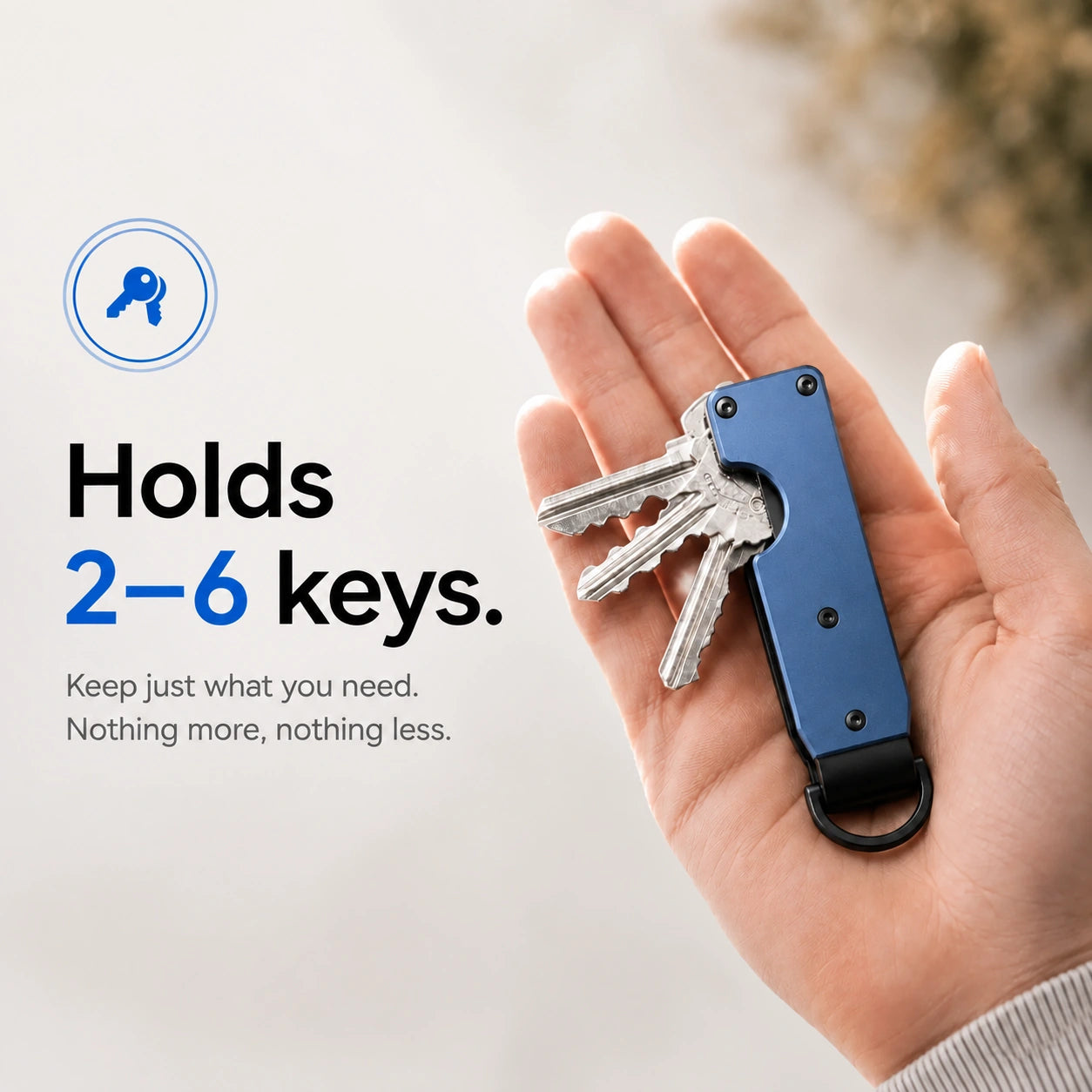 Horizon Blue compact tracking key organizer holding several keys in a palm #color_Horizon Blue