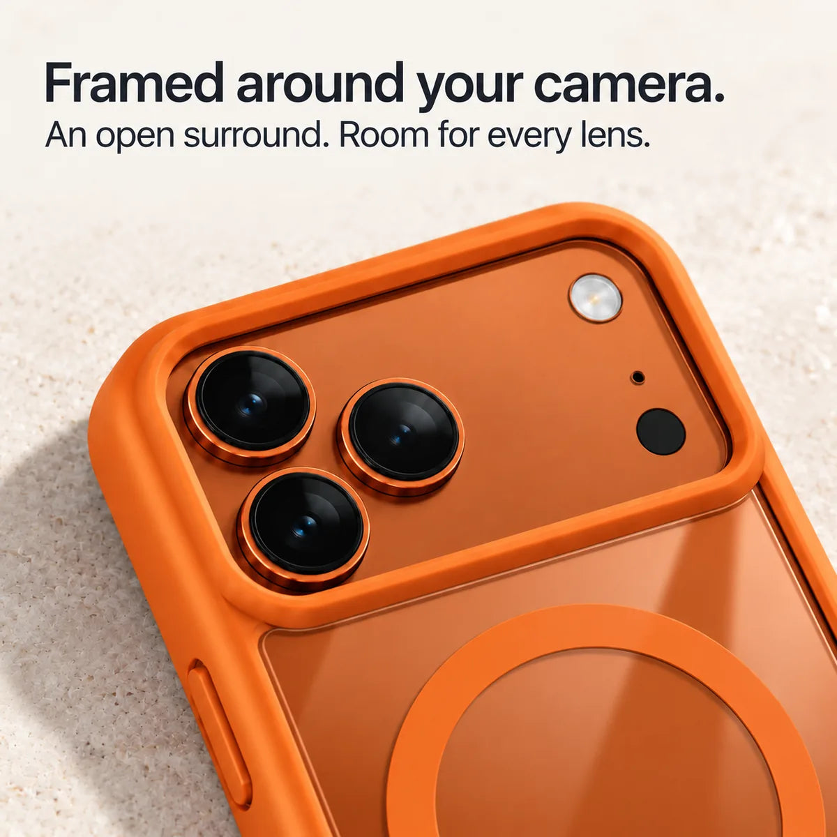 Orange phone case frame surrounding the wide rear camera opening. #color_Cosmic Orange