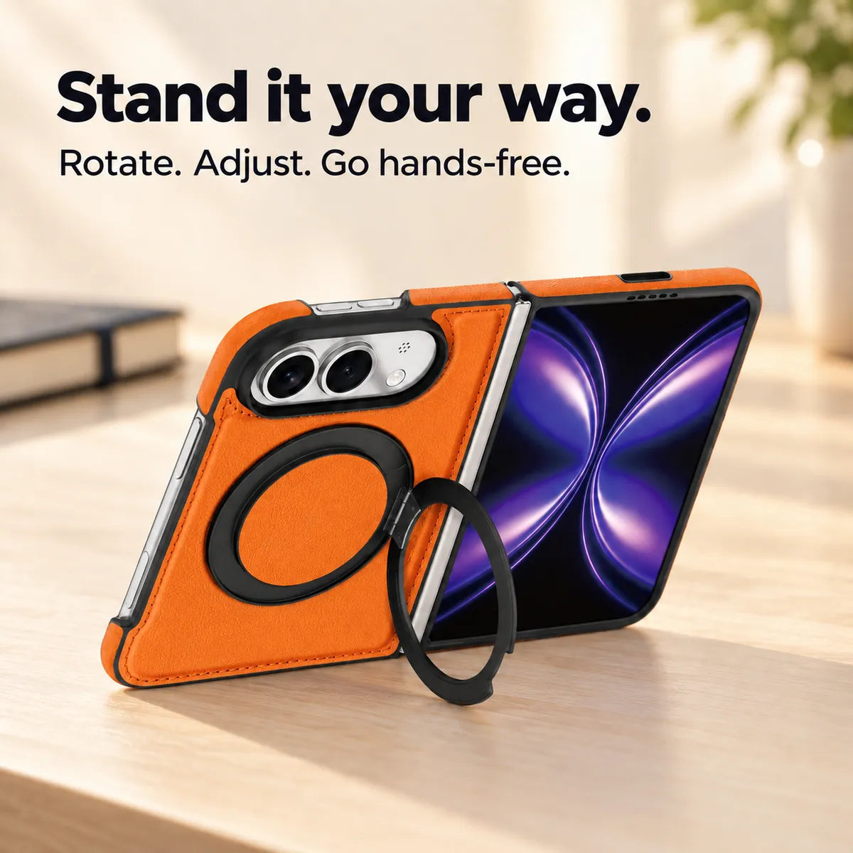 Textured synthetic leather folding phone case with its ring stand deployed on a desk. #color_Cosmic Orange