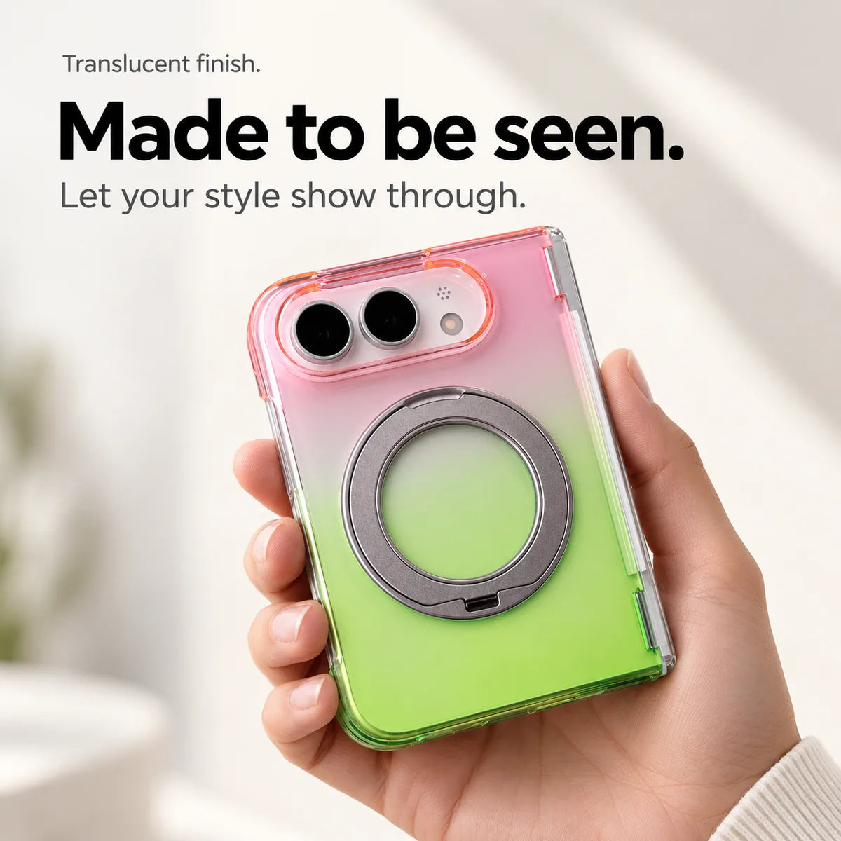 Pink and green gradient translucent rear case held in a hand with the ring folded closed. #color_Aurora Bloom