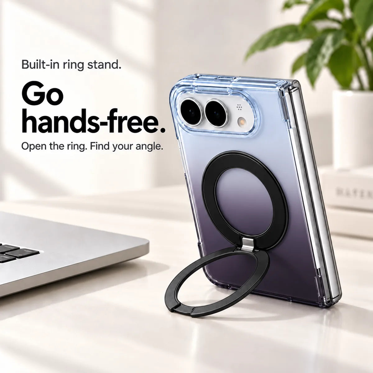 Smoky purple gradient case supporting a folded silver phone on a desk with its ring stand open. #color_Midnight Mist