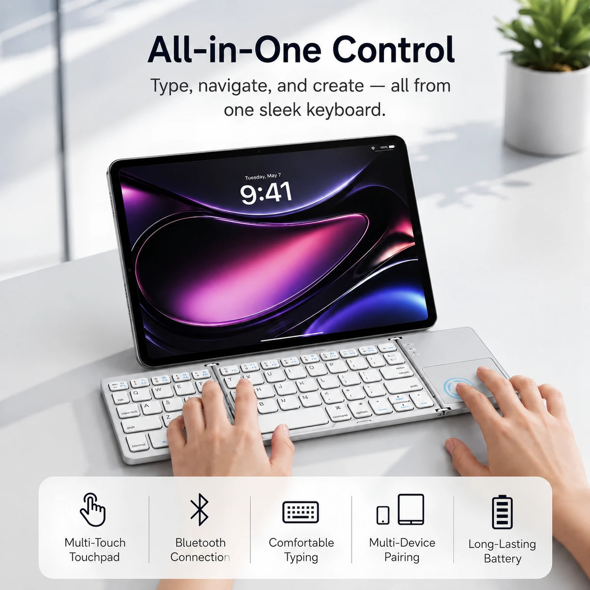 Titanium Silver folding wireless keyboard in use with a tablet #color_Titanium Silver