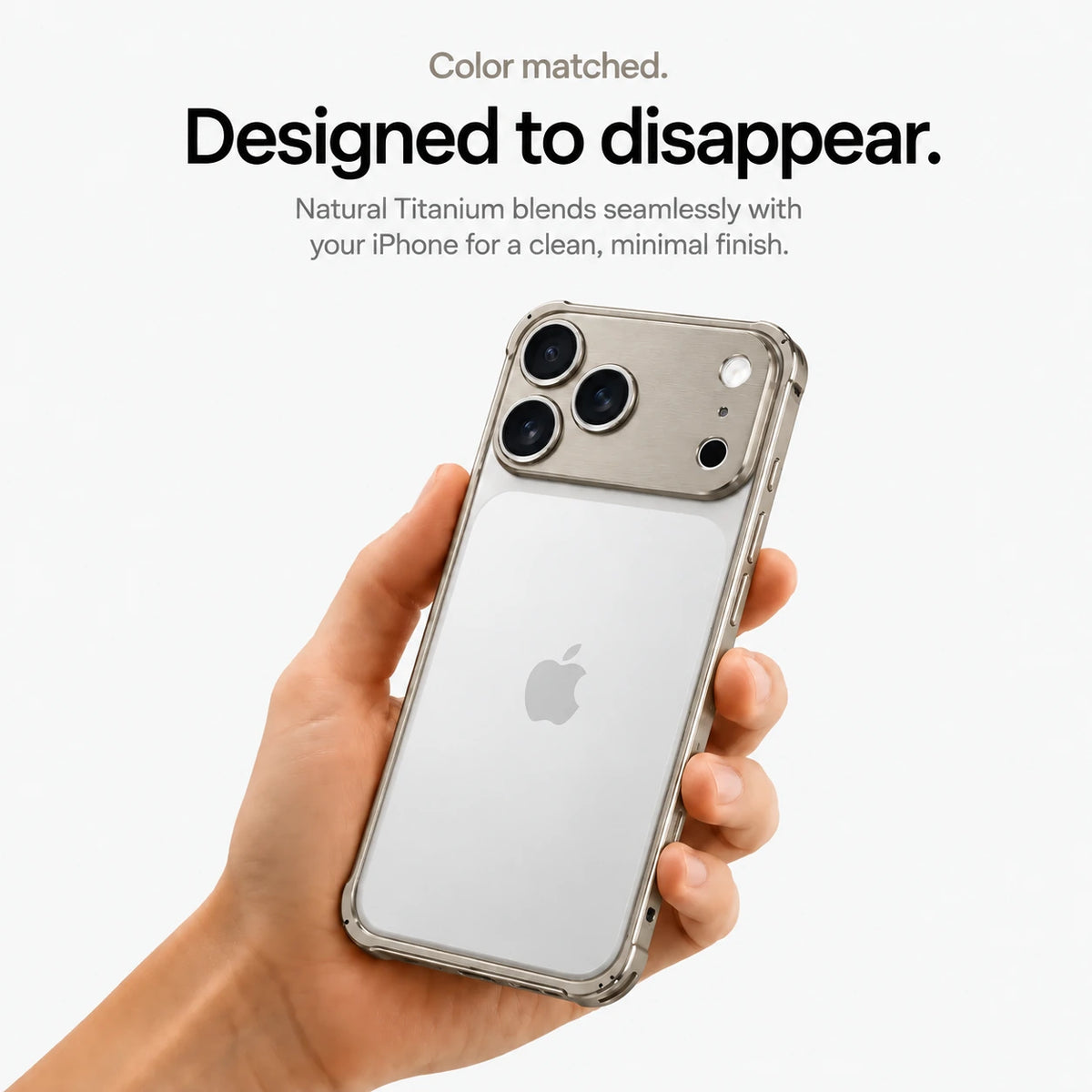 Warm gray aluminum frame phone case held in a hand showing its open back #color_Natural Titanium