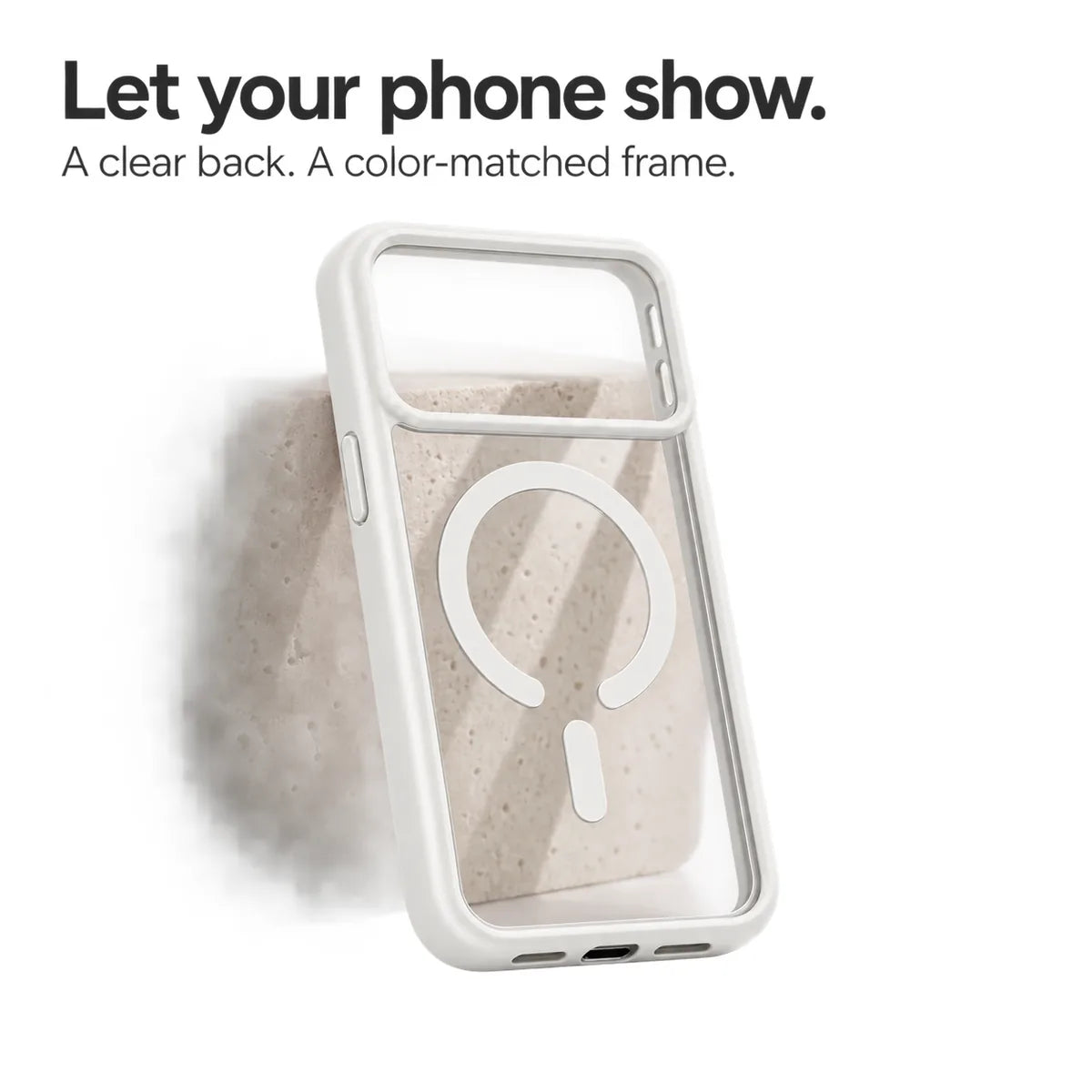 White empty phone case showing its transparent back and magnetic ring against a pale stone block. #color_Arctic White
