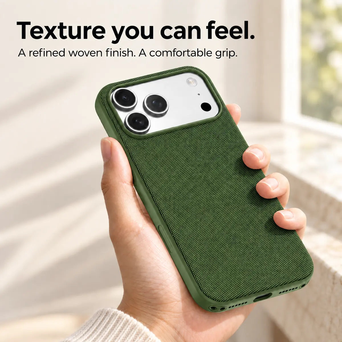 Hand holding a Forest Green woven phone case, showing its textured fabric finish. #color_Forest Green